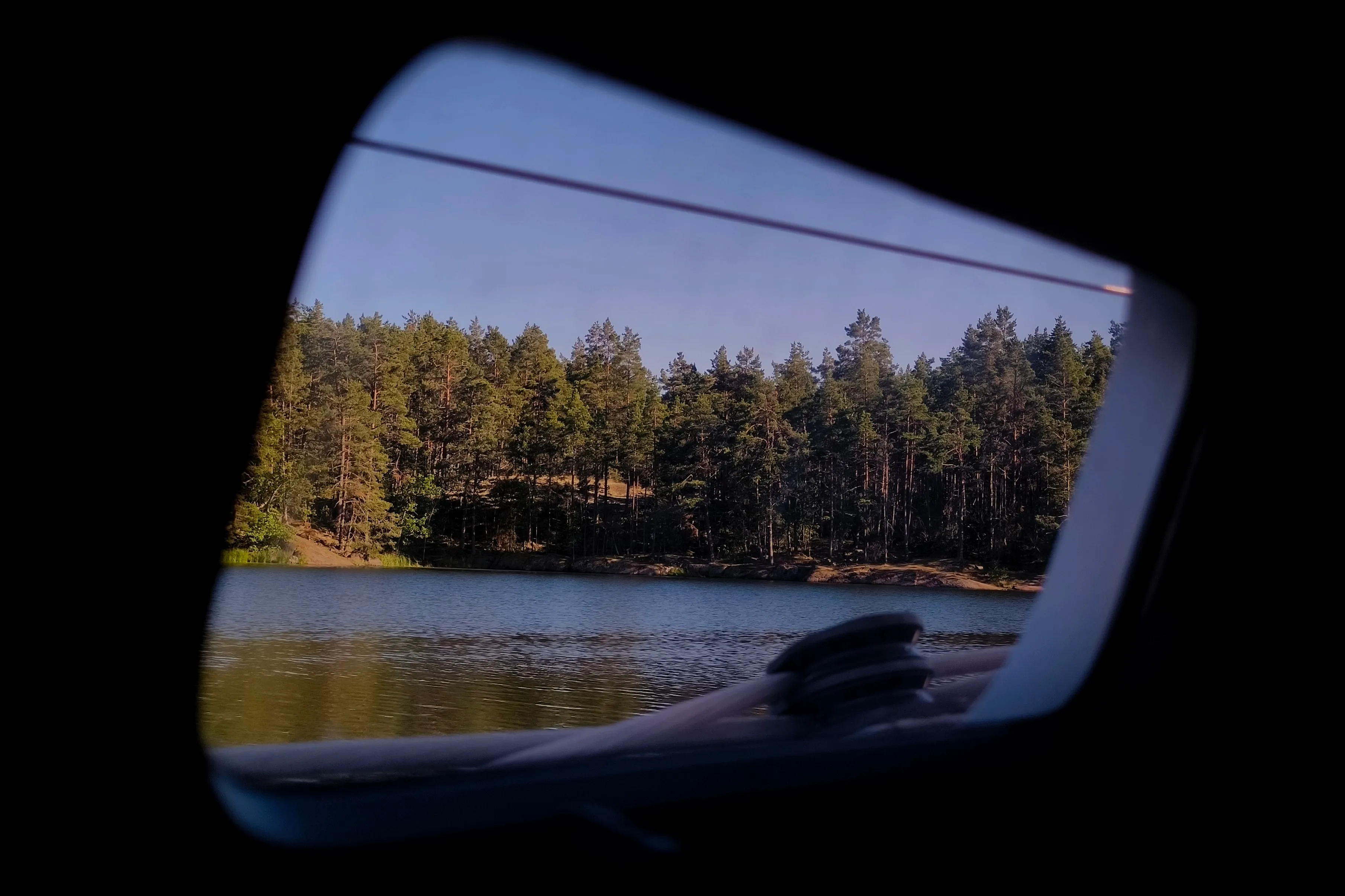 Surrounded by forest at anchor in Solberganäset, Sweden.