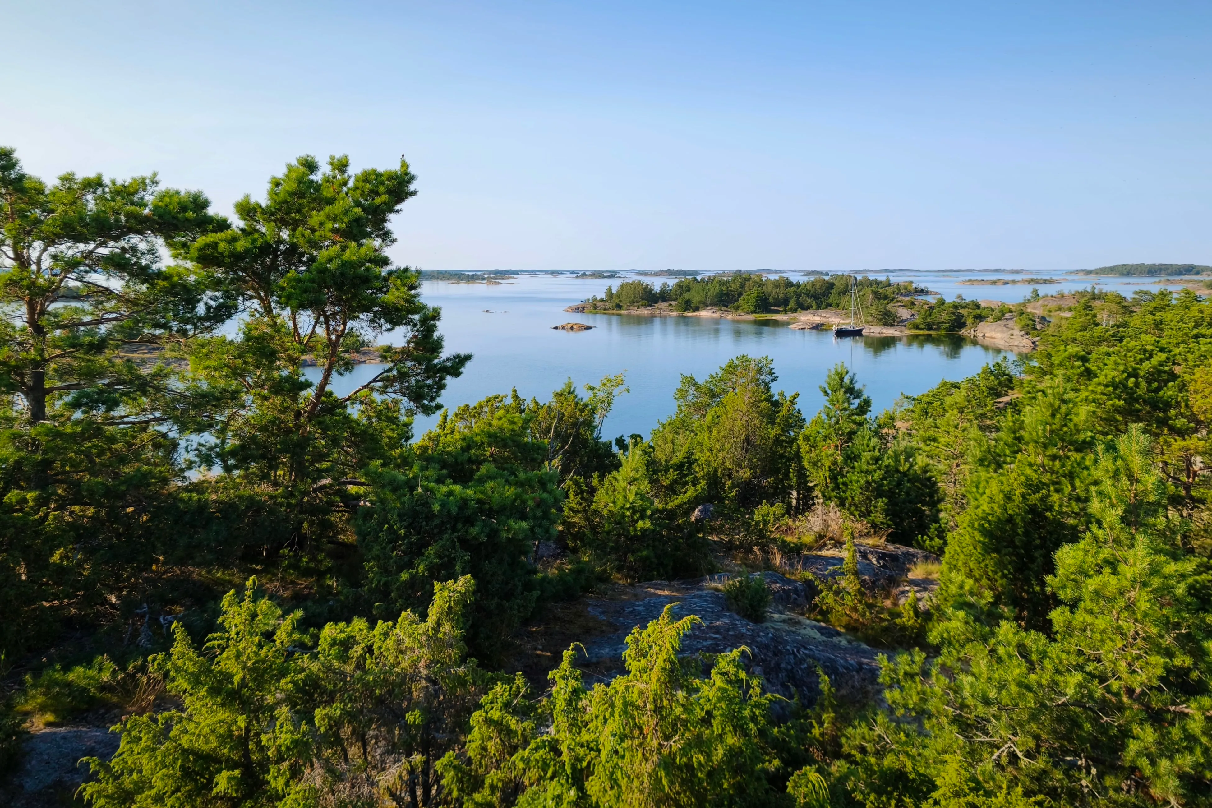 Well after ten o’clock in the evening, the sun has set over the skärgård at Kupan, Sweden.