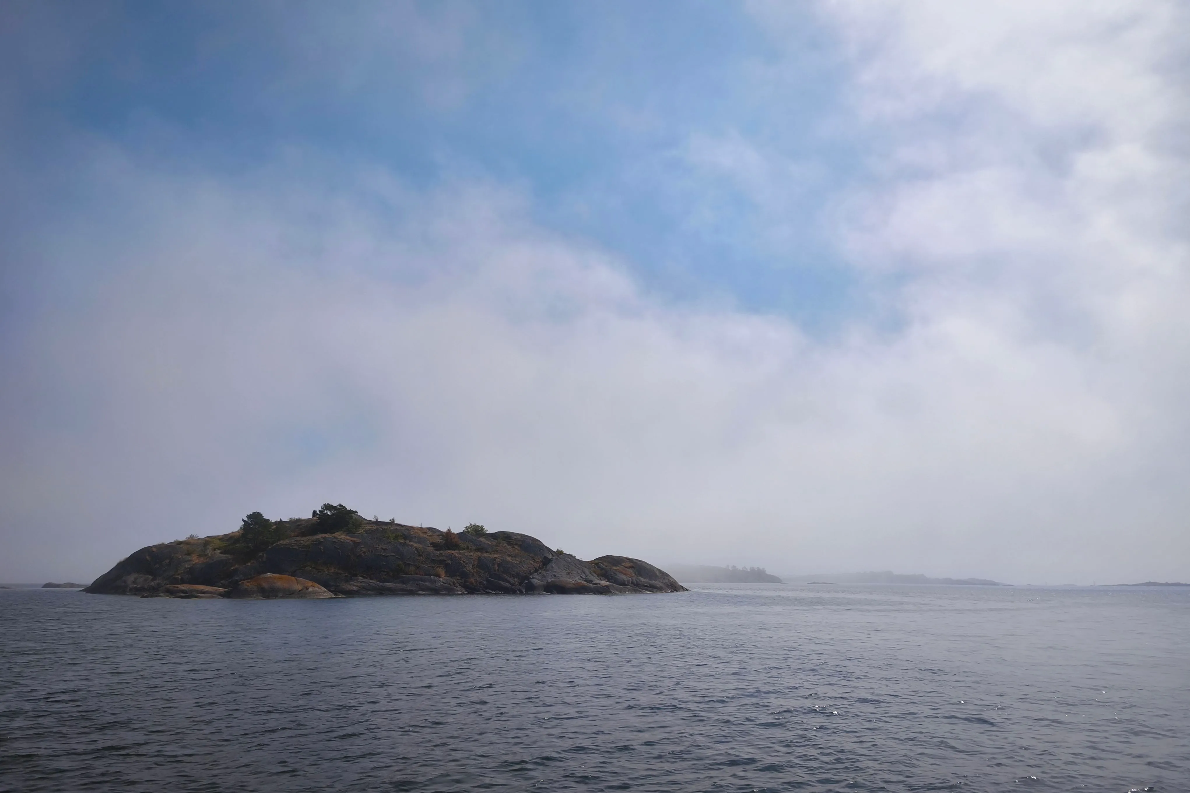 Sudden fog appearing from the sea obscures the skerries near Öja south of Nynäshamn.